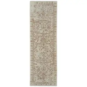 Photo of 8' Ivory Tan And Pink Wool Floral Tufted Handmade Distressed Runner Rug