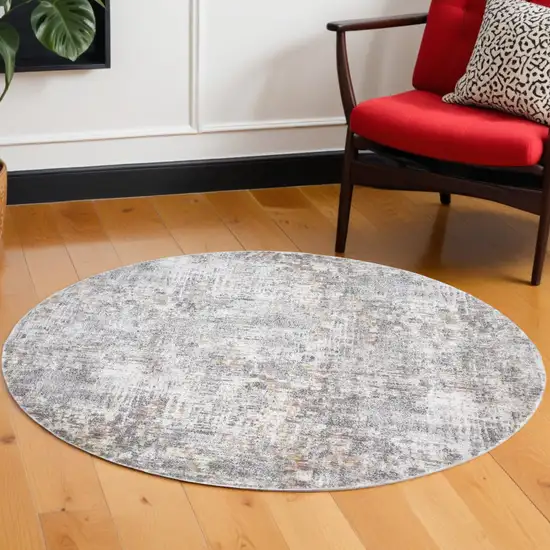 6' Ivory Tan And Taupe Round Abstract Stain Resistant Area Rug Photo 1