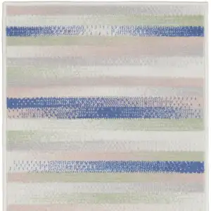 Photo of 8' Ivory Tan and Blue Abstract Distressed Non Skid Runner Rug