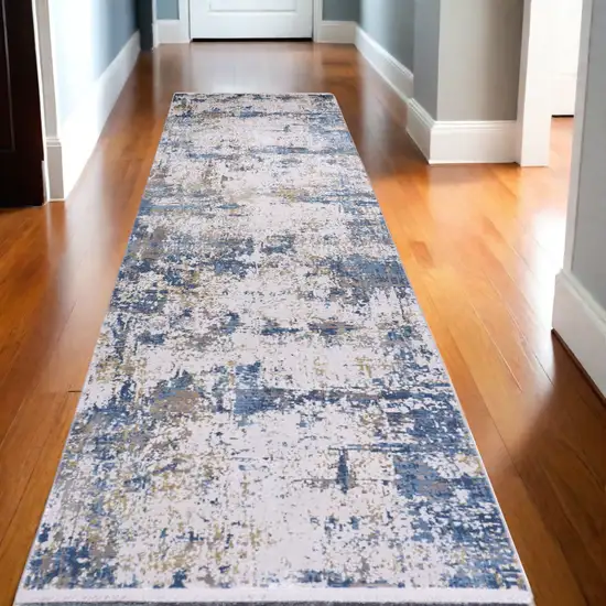 10' Ivory Tan and Blue Abstract Power Loom Runner Rug With Fringe Photo 1