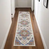 Photo of 8' Ivory Tan and Blue Floral Medallion Non Skid Runner Rug