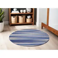 Photo of 5' Ivory Tan and Blue Striped Round Rug