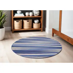 Photo of 5' Ivory Tan and Blue Striped Round Rug