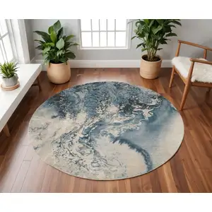 Photo of 8' Ivory Teal Blue and Black Abstract Non Skid Round Rug