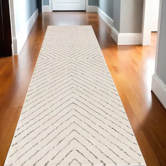 10' Ivory and Black Geometric Runner Rug Photo 1