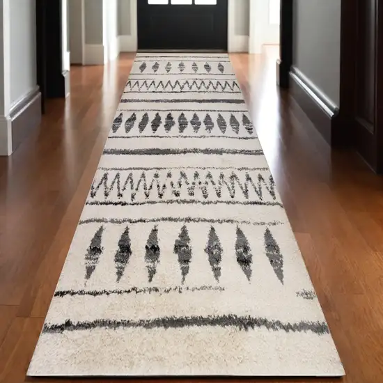 10' Black and Ivory Geometric Shag Runner Rug Photo 1