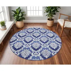 Photo of 8' Ivory and Blue Damask Distressed Round Rug