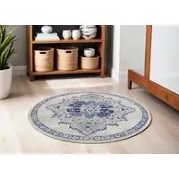 Photo of 5' Ivory and Blue Floral Medallion Round Rug