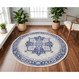 Photo of 8' Ivory and Blue Floral Round Rug