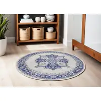 Photo of 5' Ivory and Blue Floral Round Rug