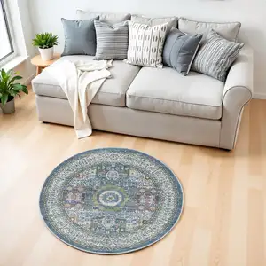 Photo of 4' Ivory and Blue Geometric Distressed Non Skid Round Rug