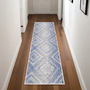 Photo of 8' Ivory and Blue Geometric Distressed Non Skid Runner Rug