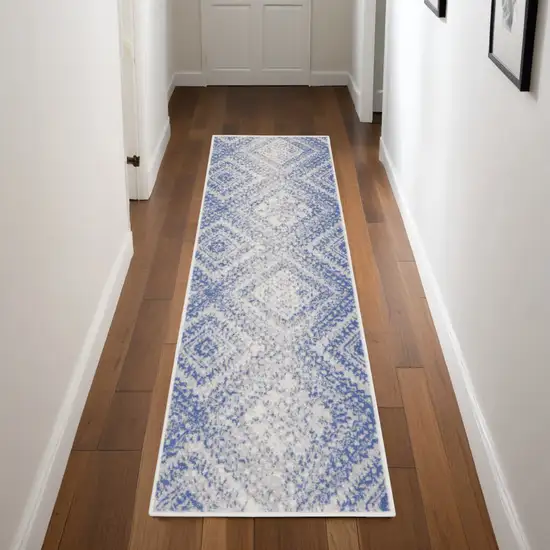 8' Ivory and Blue Geometric Distressed Non Skid Runner Rug Photo 1