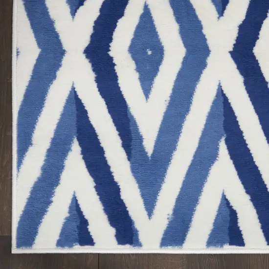 8' Ivory and Blue Geometric Distressed Non Skid Runner Rug Photo 4