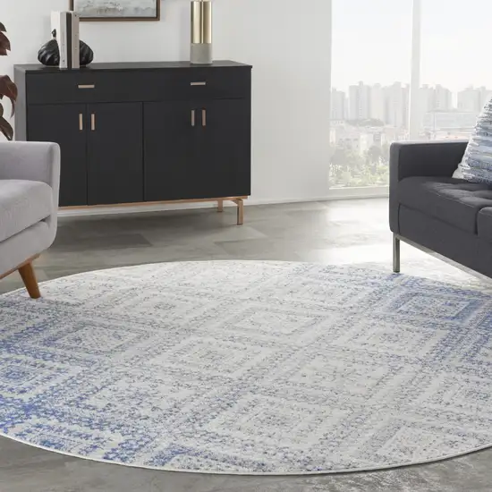 8' Ivory and Blue Geometric Distressed Round Rug Photo 7