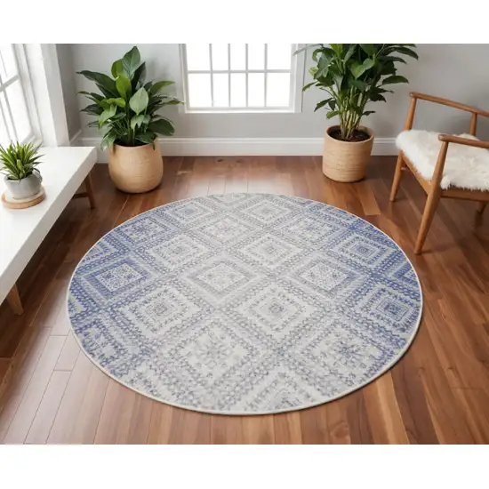 8' Ivory and Blue Geometric Distressed Round Rug Photo 1