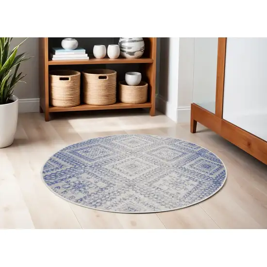 5' Ivory and Blue Geometric Distressed Round Rug Photo 1