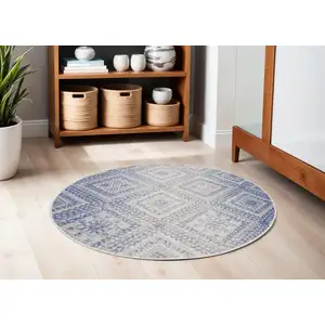 Photo of 5' Ivory and Blue Geometric Distressed Round Rug