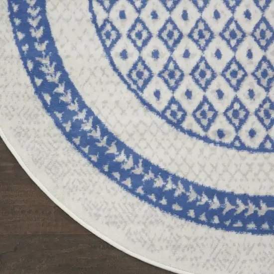 8' Ivory and Blue Geometric Distressed Round Rug Photo 4