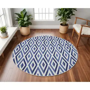 Photo of 8' Ivory and Blue Geometric Round Rug