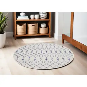 Photo of 5' Ivory and Blue Geometric Round Rug