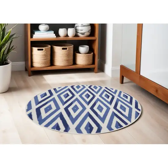 5' Ivory and Blue Geometric Round Rug Photo 1