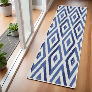 Photo of 6' Ivory and Blue Geometric Runner Rug