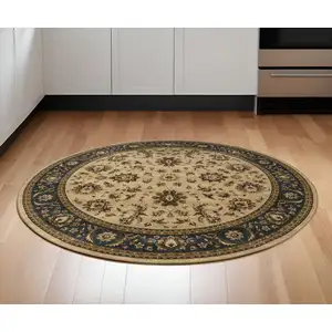 Photo of 6' Ivory and Blue Oriental Round Rug