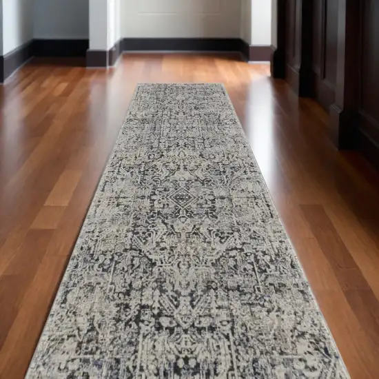 12' Ivory and Gray Abstract Power Loom Worn Faded Runner Rug With Fringe Photo 1