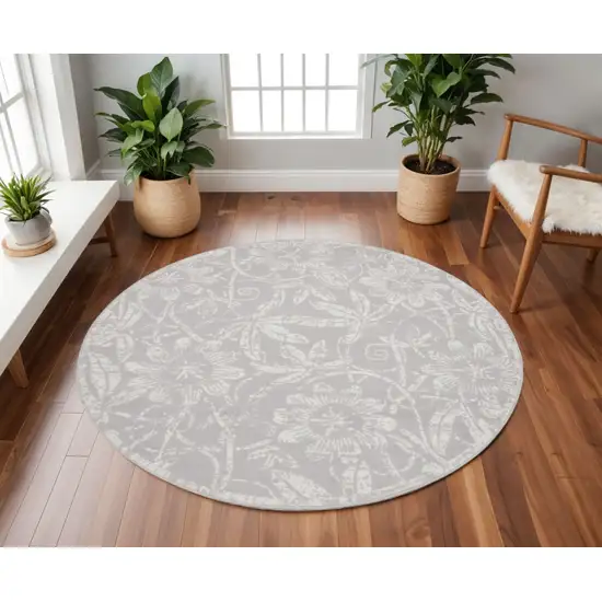 8' Ivory and Gray Floral Distressed Round Rug Photo 1