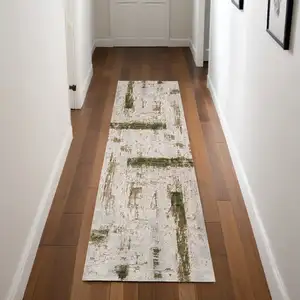 Photo of 8' Ivory and Green Abstract Power Loom Distressed Runner Rug