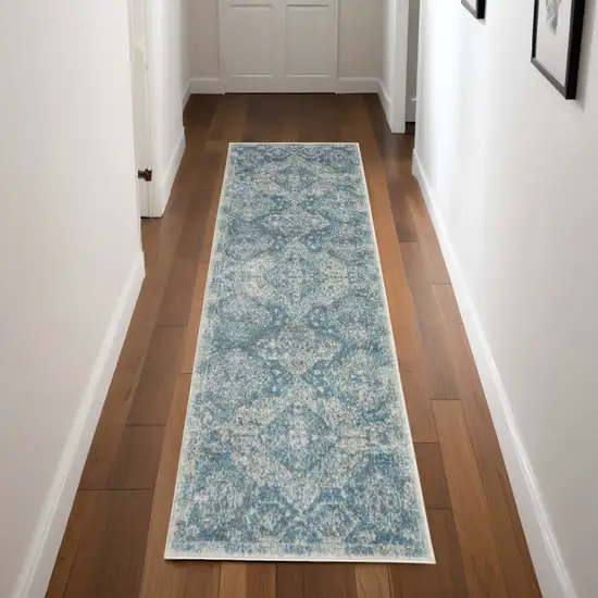 7' Ivory and Light Blue Geometric Distressed Runner Rug Photo 1