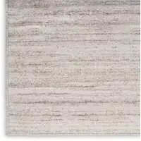 Photo of 6' Ivory and Light Brown Abstract Washable Runner Rug