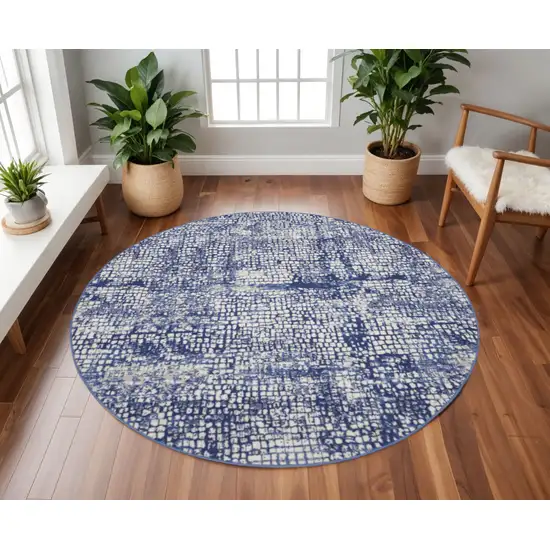 8' Ivory and Navy Blue Abstract Round Rug Photo 1