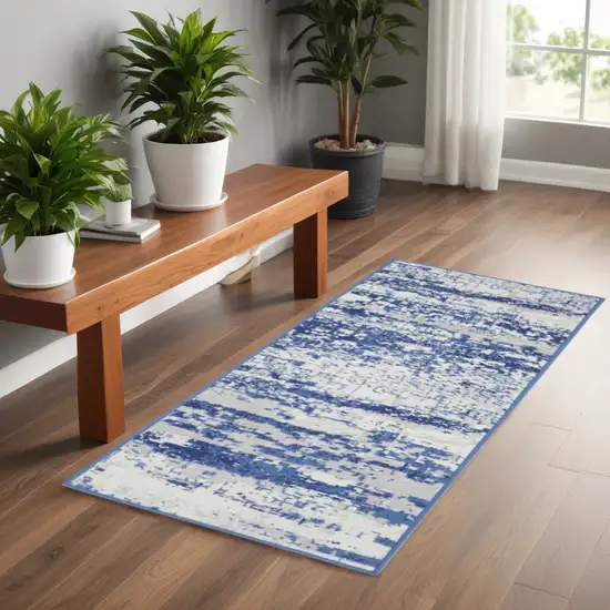 6' Ivory and Navy Blue Abstract Runner Rug Photo 1