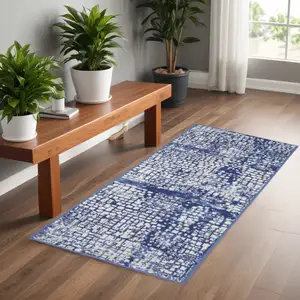 Photo of 6' Ivory and Navy Blue Abstract Runner Rug