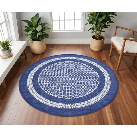 8' Ivory and Navy Blue Geometric Distressed Round Rug Photo 1