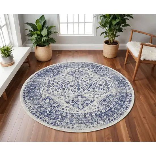 8' Ivory and Navy Blue Geometric Distressed Round Rug Photo 1