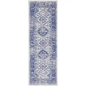 Photo of 6' Ivory and Navy Blue Geometric Distressed Runner Rug