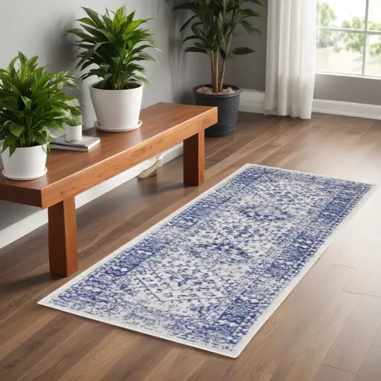 6' Ivory and Navy Blue Geometric Distressed Runner Rug Photo 1