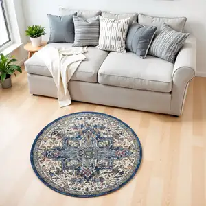 Photo of 4' Ivory and Orange Floral Medallion Distressed Non Skid Round Rug