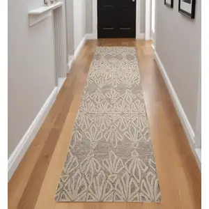 Photo of 8' Ivory and Tan Geometric Hand Tufted Runner Rug