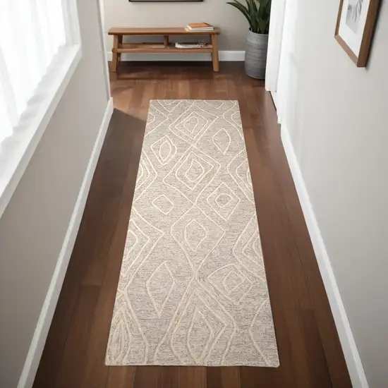 8' Ivory and Tan Geometric Hand Tufted Runner Rug Photo 1