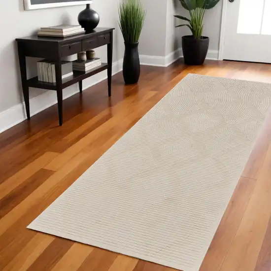 8' Ivory and Tan Geometric Power Loom Runner Rug Photo 1