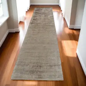 Photo of 10' Ivory and Tan Hand Woven Runner Rug