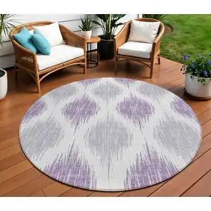 Photo of 8' Lavender Purple And Ivory Round Ikat Washable Indoor Outdoor Area Rug