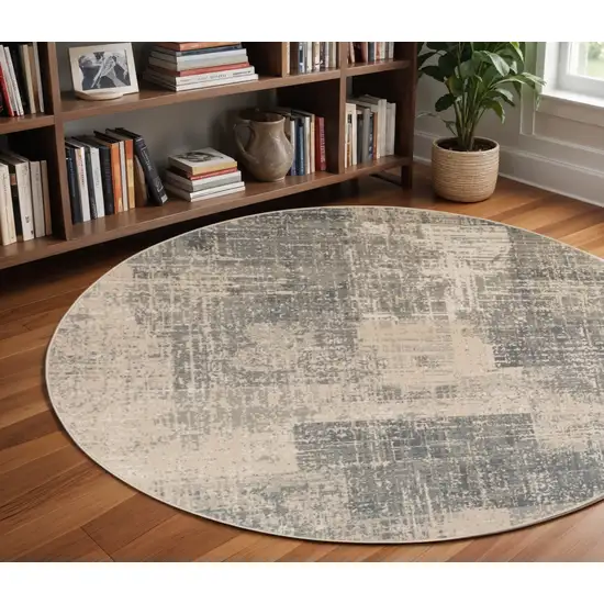 8' Gray and Light Blue Abstract Power Loom Round Rug Photo 1