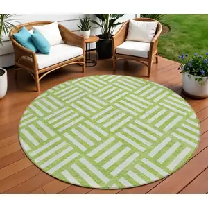 Photo of 8' Lime Green And Ivory Round Geometric Washable Indoor Outdoor Area Rug