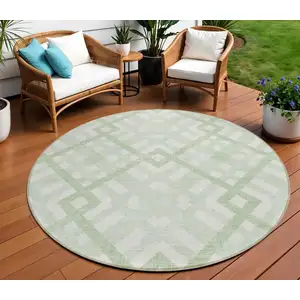 Photo of 8' Mint Green And Ivory Round Geometric Washable Indoor Outdoor Area Rug