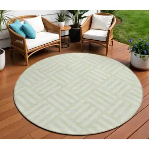 Photo of 8' Mint Green And Ivory Round Geometric Washable Indoor Outdoor Area Rug